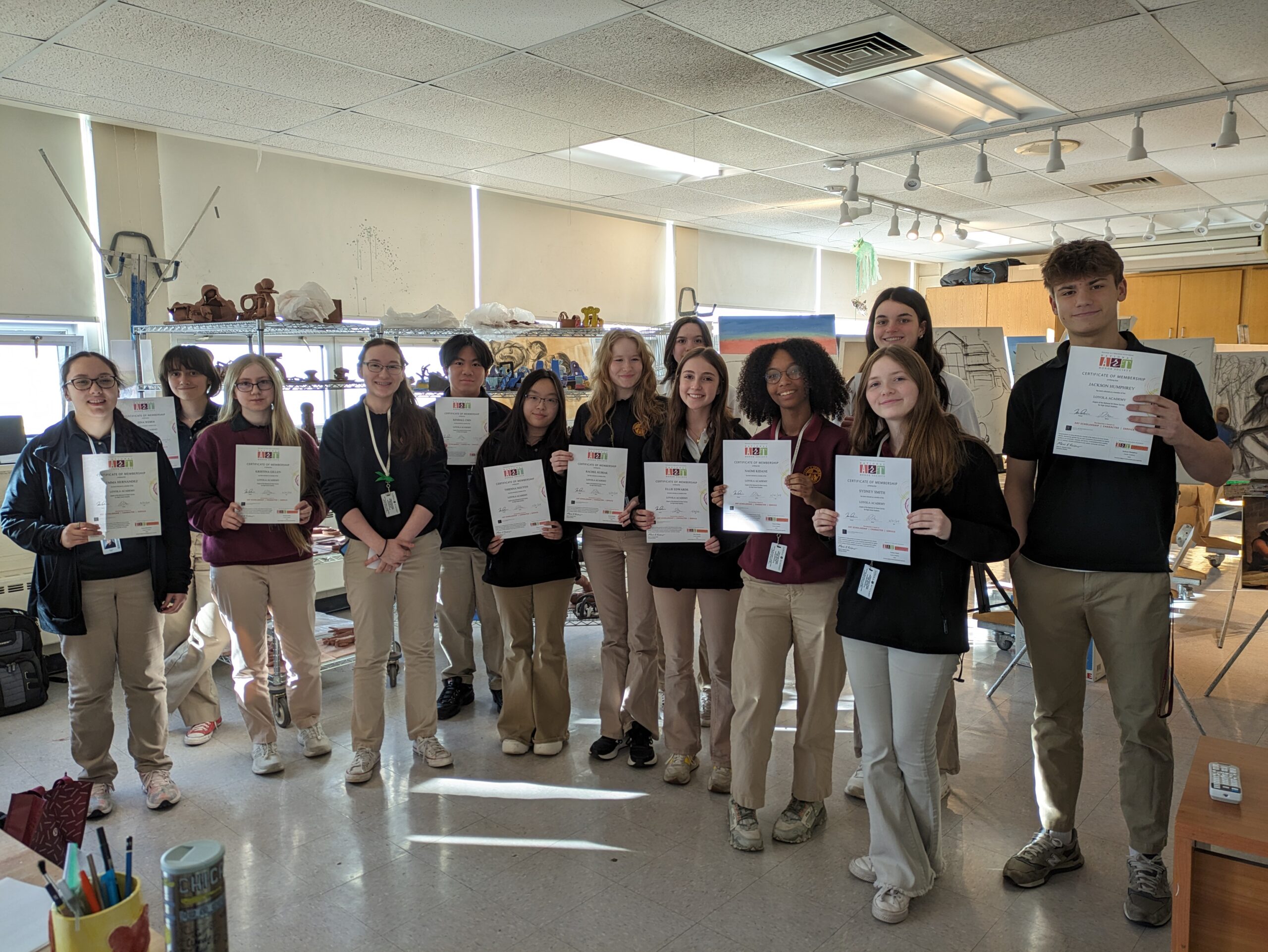 group photo of NAHS students holding up their certificates of membership