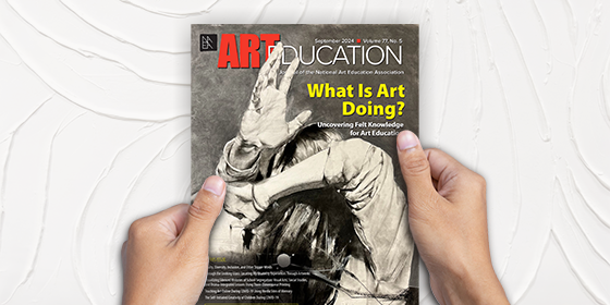 Front cover of Art Education journal. The issue is titled "What Is Art Doing?" A woman is depicted in greyscale with her arms in front of her face.